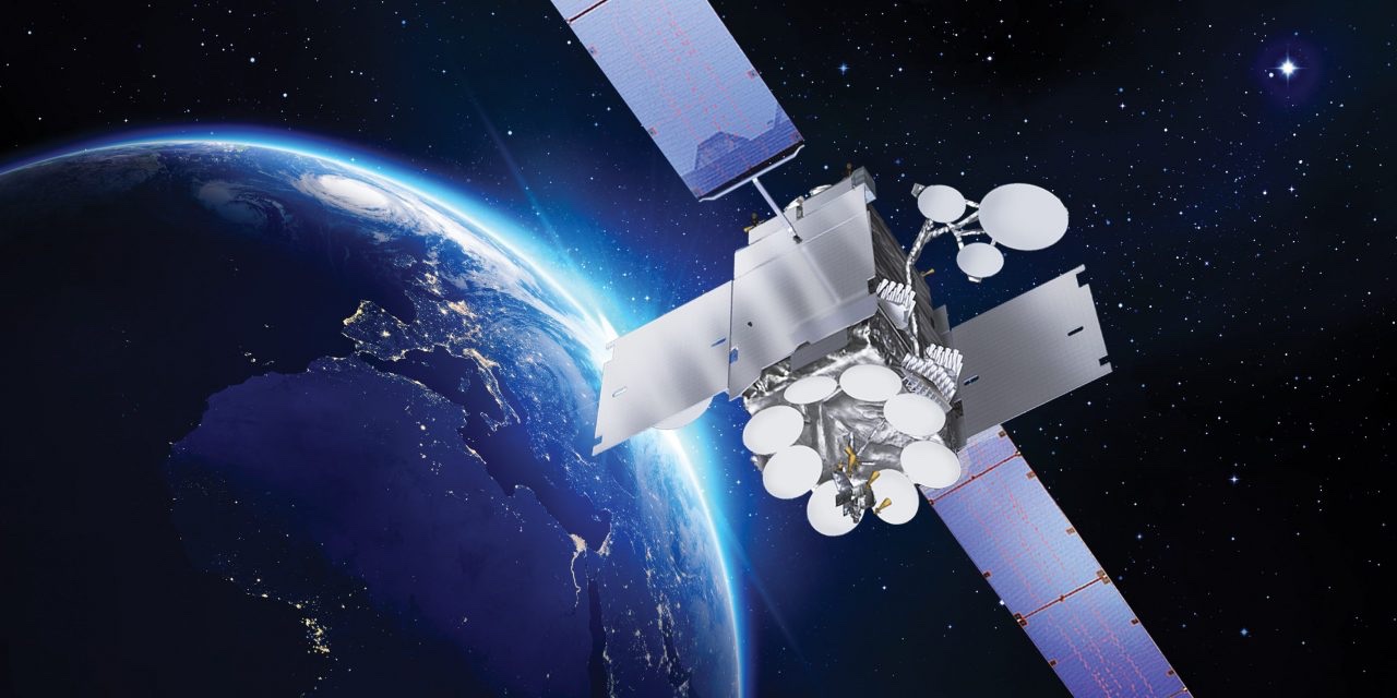 Illustration of a communications satellite in orbit above the night side of Earth